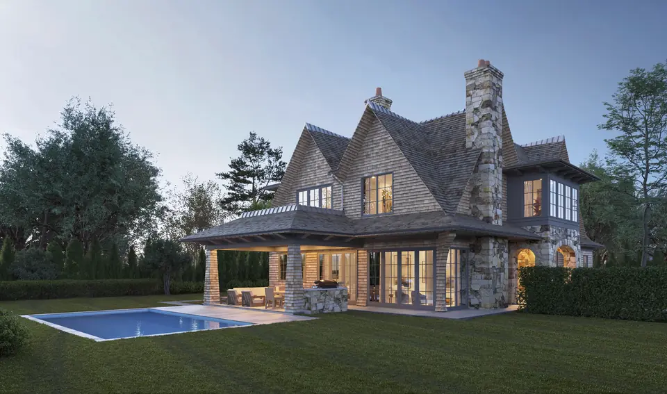 Fieldstone chimney and covered loggia beside a pool
